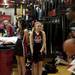 A Milan High School cheerleader watches the basketball team take the court for warmups on Friday. Daniel Brenner I AnnArbor.com